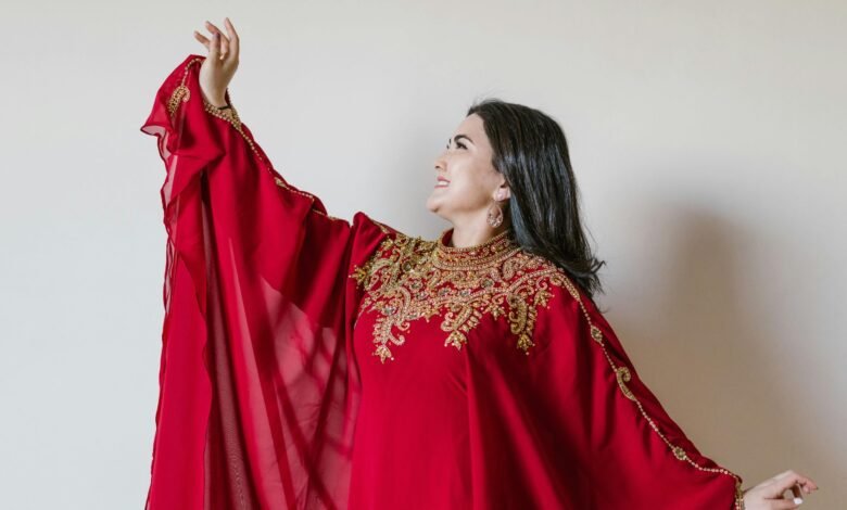 A chubby girl wearing a beautiful red Asian suit