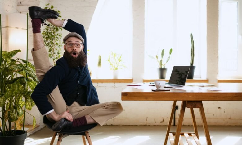 An employee stretching for work-life balance in a work environment to foster productivity & well-being