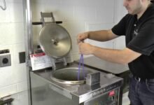 Man using pressure fryer