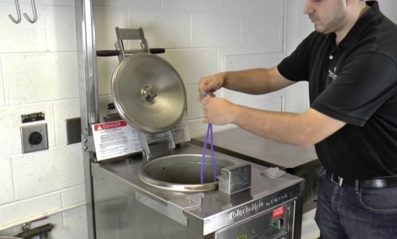 Man using pressure fryer